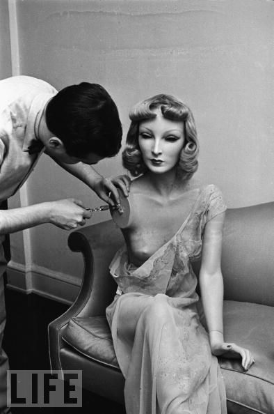 Gaba repairs shoulder on Cynthia, NY, 1937. He almost looks like a doctor attending to a patient. 