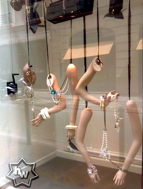 Jewelry displayed on mannequin arms draws attention 