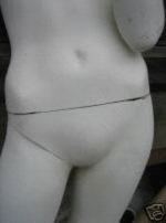 Mannequin with a torso and leg that detach from the body